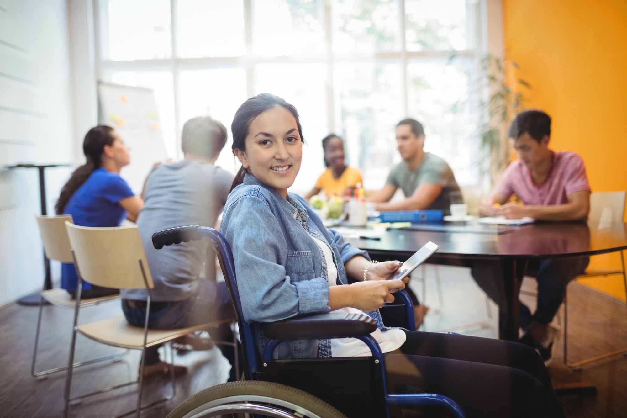 handicapped-business-executive-using-digital-tablet